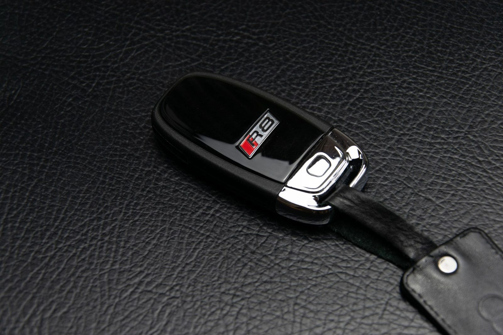 Automotive locksmith working on a car door lock with professional key tools