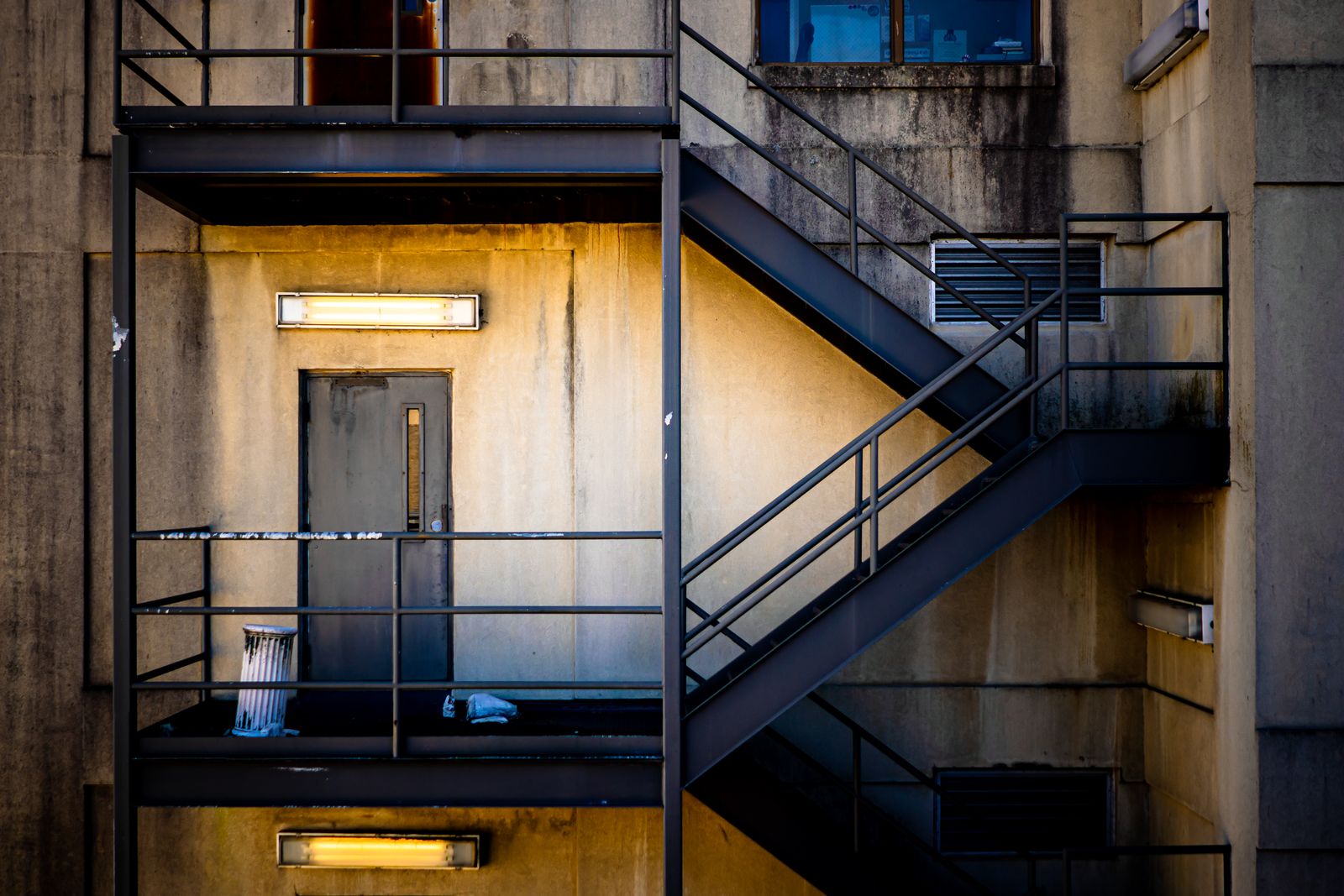 Building fire escape exit door with emergency signage