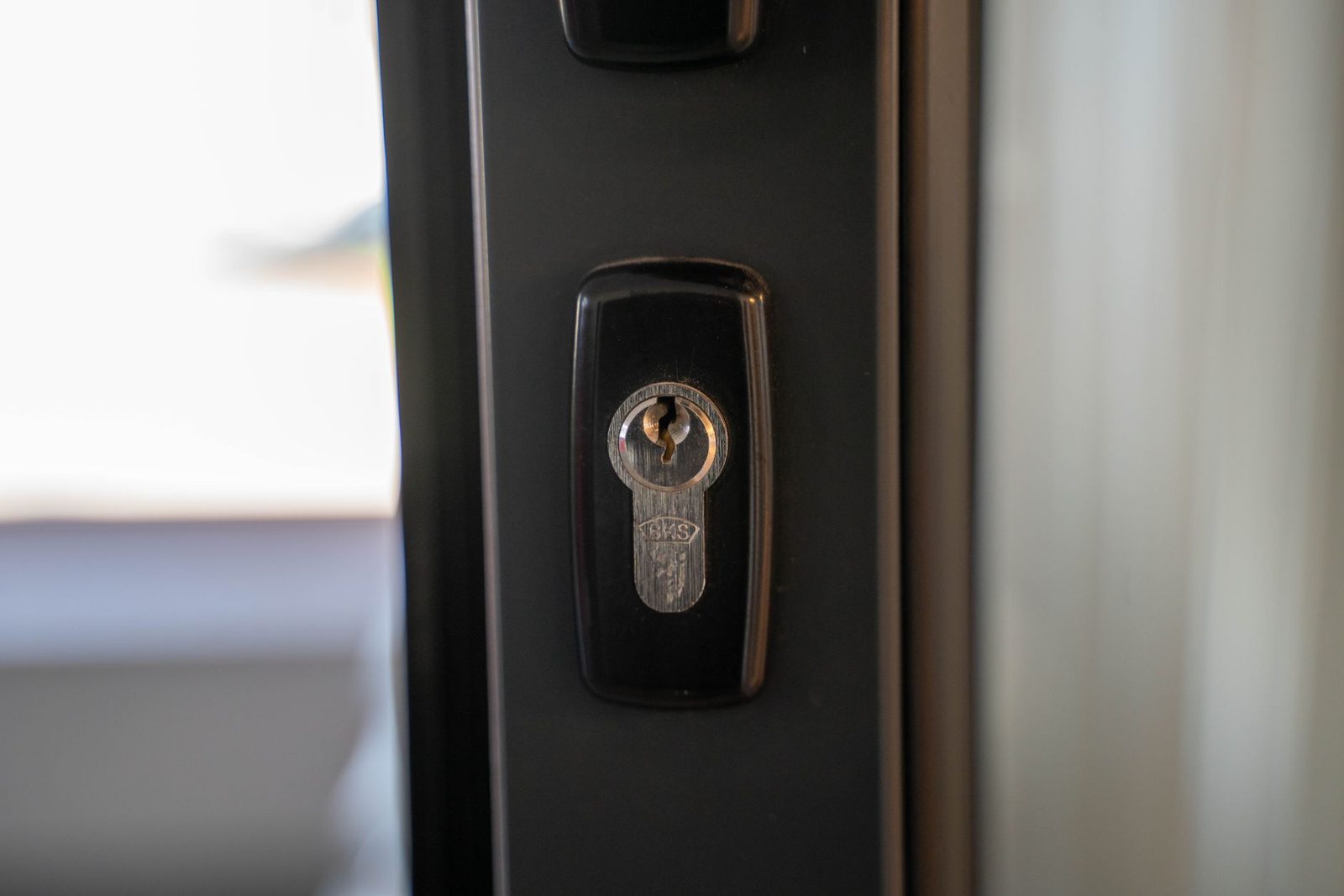 Close-up of a professional-grade deadbolt lock being installed on a door