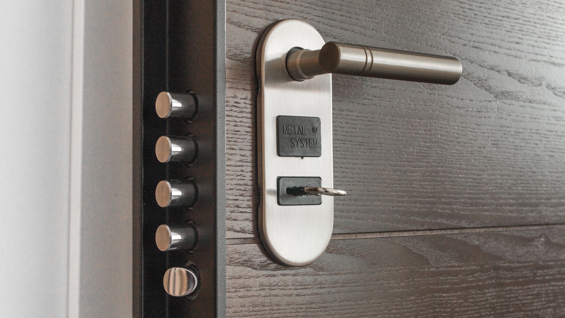 Professional locksmith working on a high-security lock in New York City
