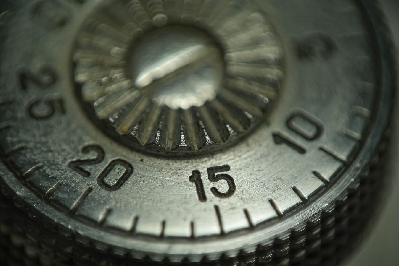 Close-up of a mechanical combination dial on a locked safe